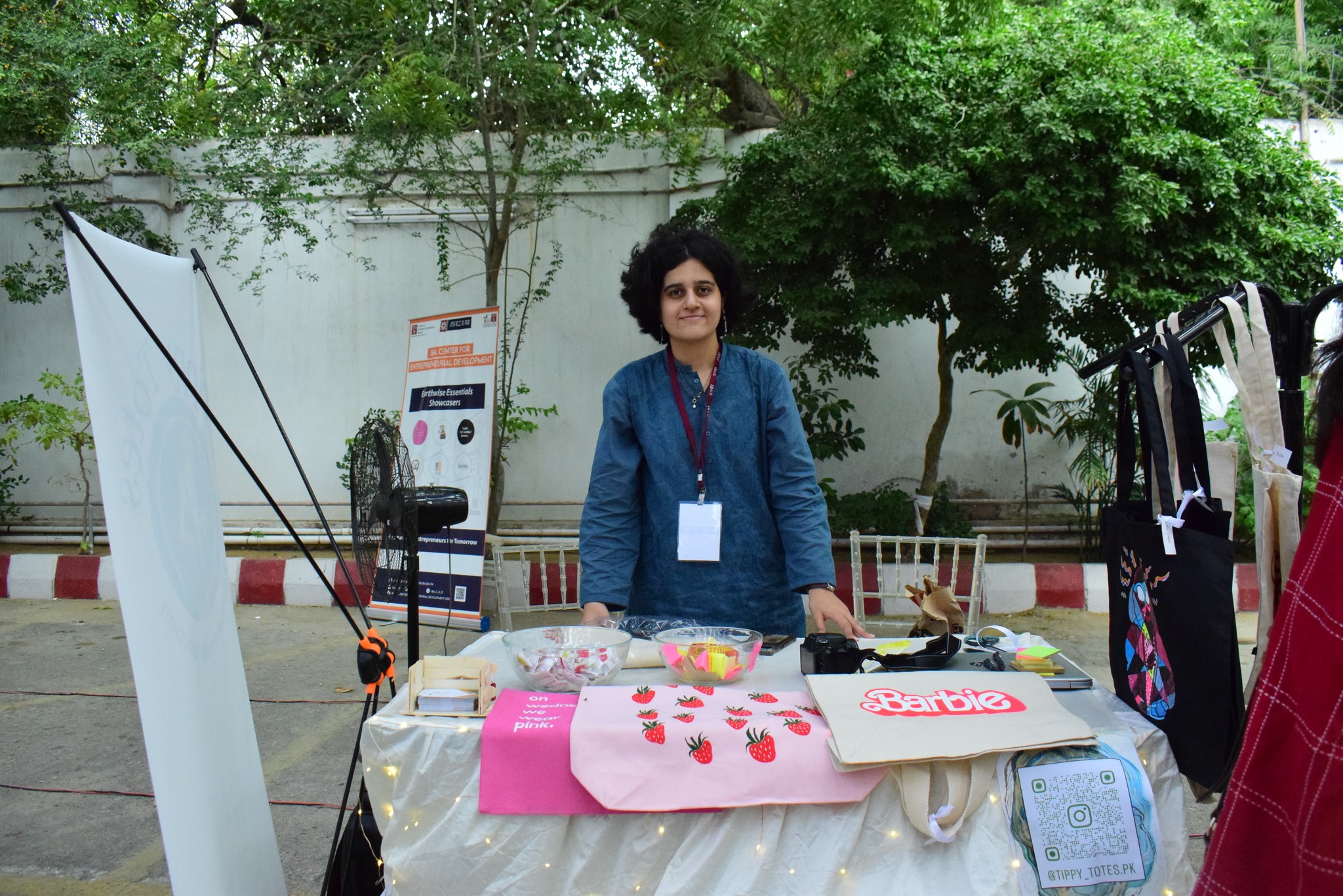 Handcrafted tote bags and accessories on display at an I-Bazaar stall